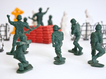 Tiny toy soldiers staging an intense combat scene