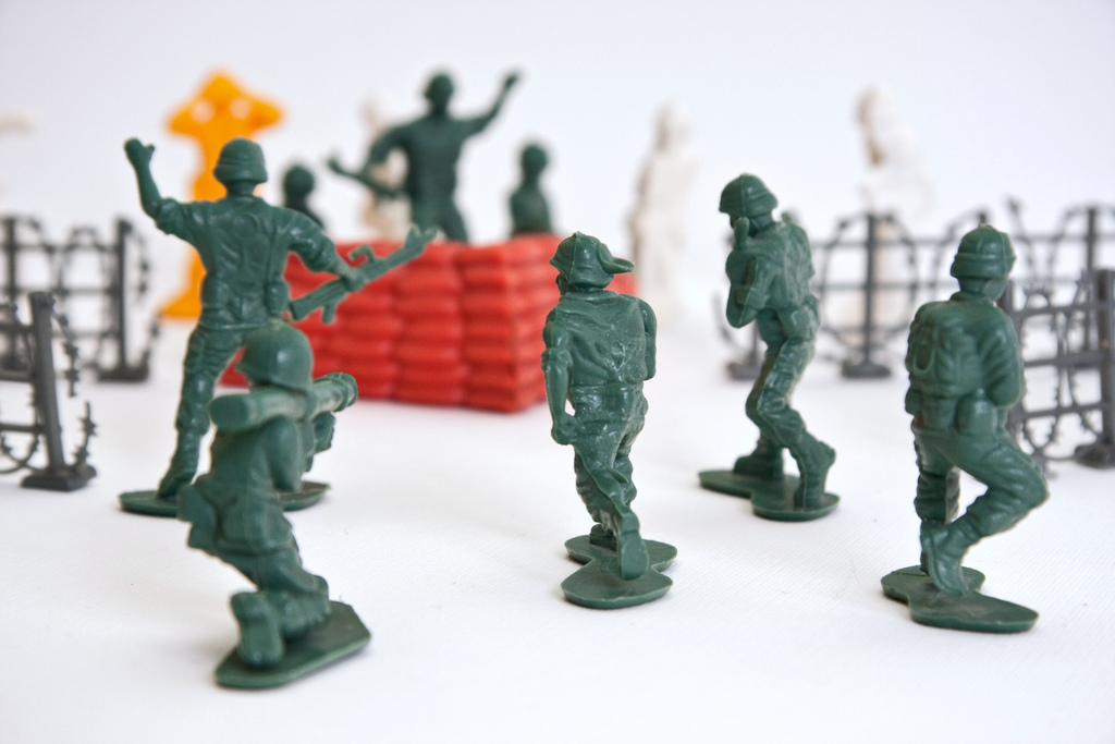 Tiny toy soldiers staging an intense combat scene