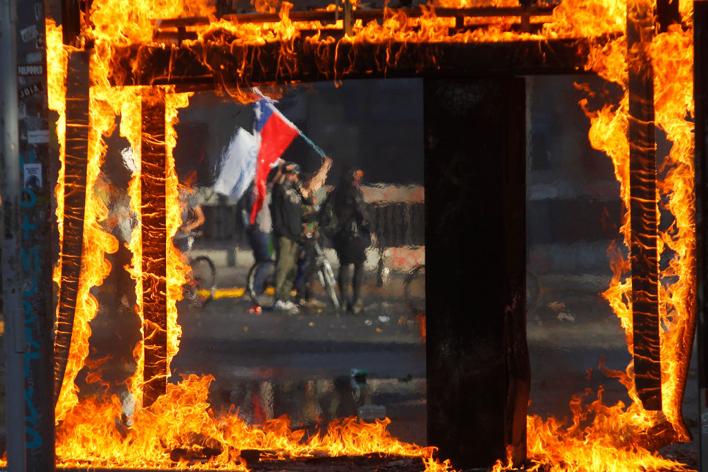 Protests Continue In Chile After President Piñera Declared State of Emergency And Suspended Subway Fare Hike
