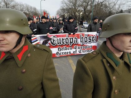 Clad in WWII Hungarian uniform,  two pro