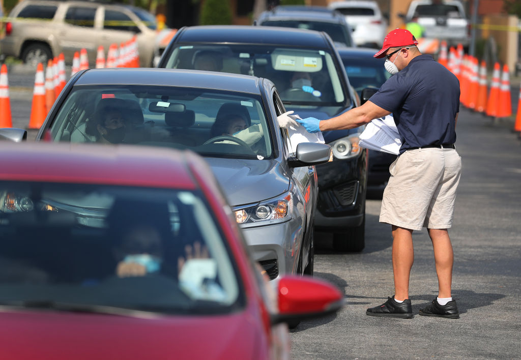 People Line Up For Unemployment Applications In Hialeah, FL During COVID-19 Crisis