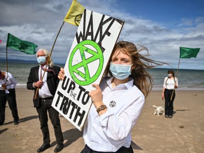 Extinction Rebellion Hold Heads In The Sand Protest At Nairn