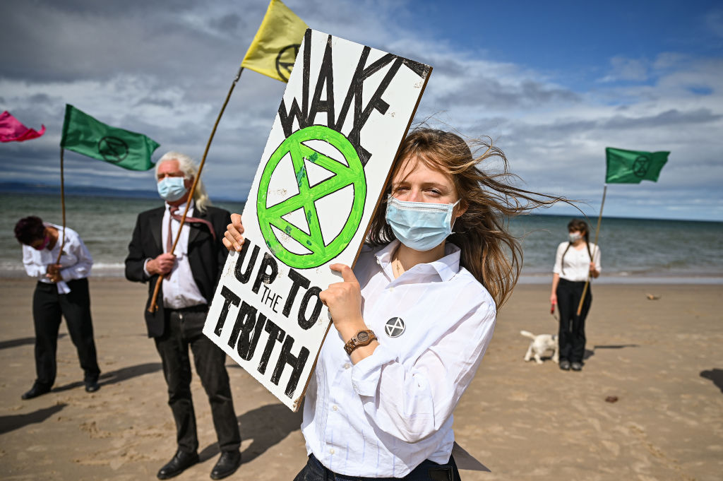 Extinction Rebellion Hold Heads In The Sand Protest At Nairn