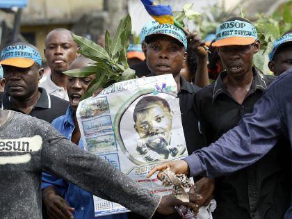 Ogoni indigenes carrying a poster of Ken