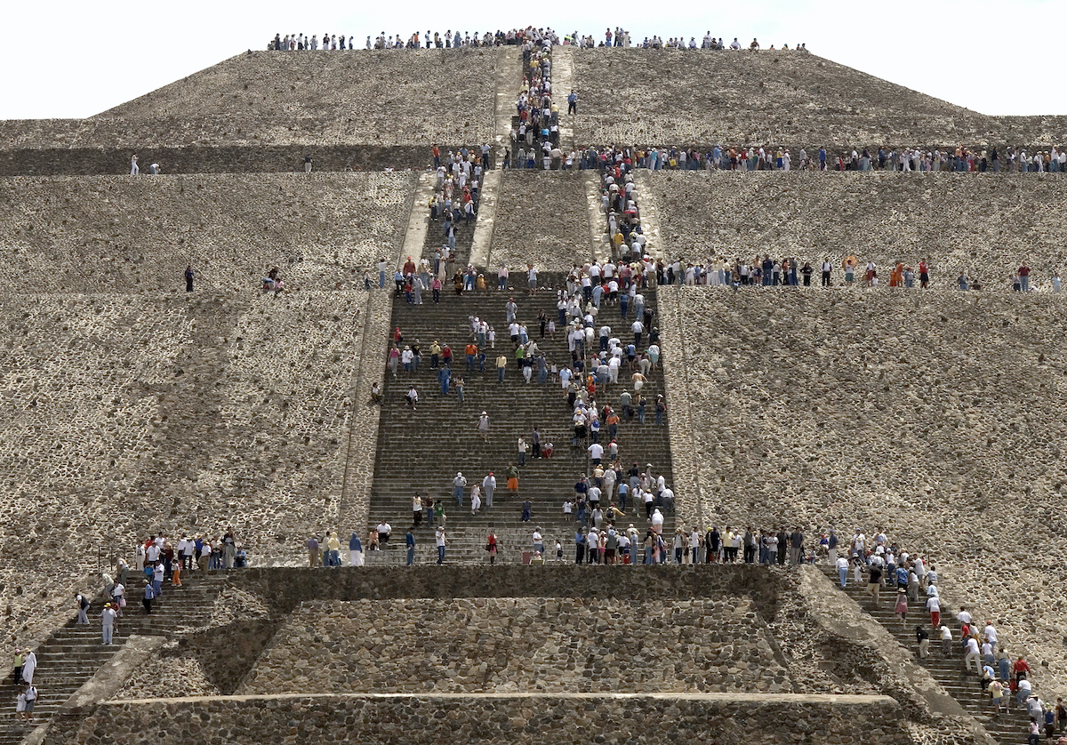 Mexico, Mexico City, people on steps of Teotihuacan pyramids