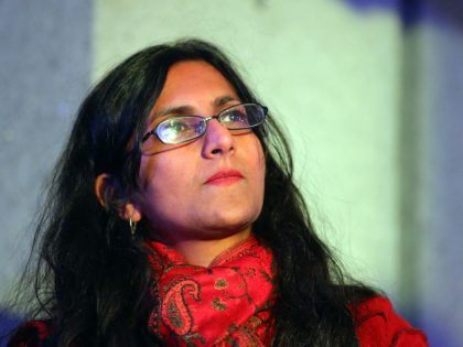 Seattle city council member Kshama Sawant listens to speakers during a rally for women's rights on International Women's Day, Wednesday, March 8, 2017, at Westlake Park.  (Genna Martin, seattlepi.com)