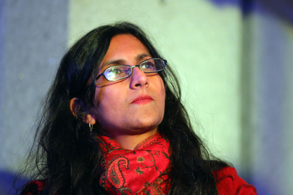 Seattle city council member Kshama Sawant listens to speakers during a rally for women's rights on International Women's Day, Wednesday, March 8, 2017, at Westlake Park.  (Genna Martin, seattlepi.com)