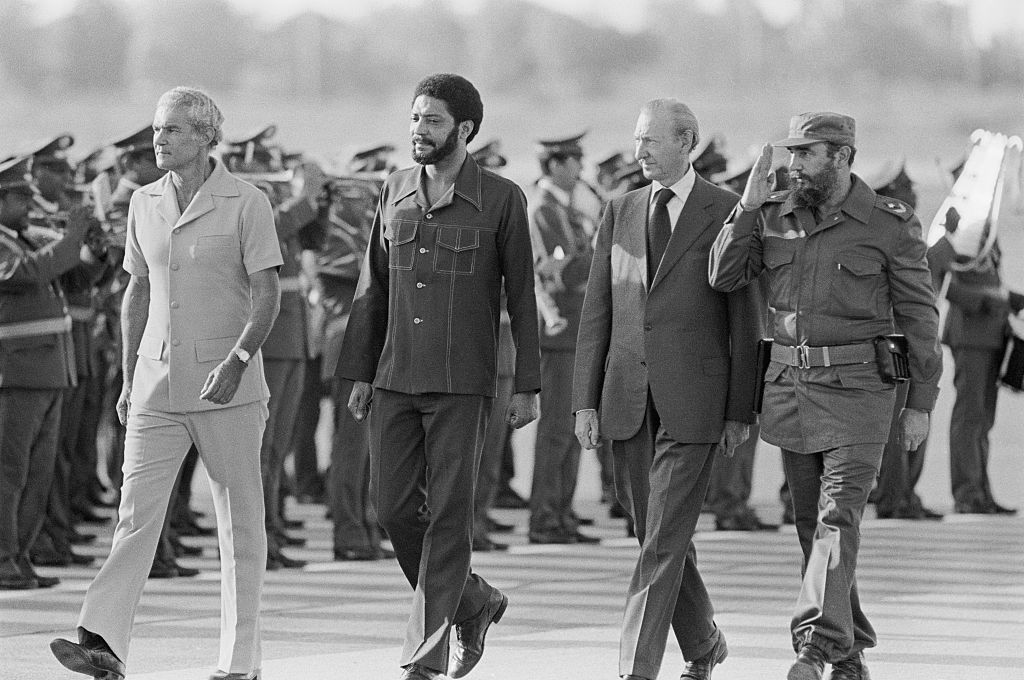 Fidel Castro Saluting with Foreign Officials