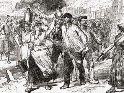 Rioters and Pétroleuses, female supporters of the Paris Commune, firing public buildings in Paris, France during the last days of the Commune, May 1871