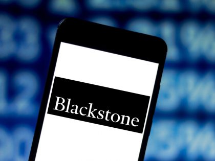 In this photo illustration the Blackstone Group logo is seen