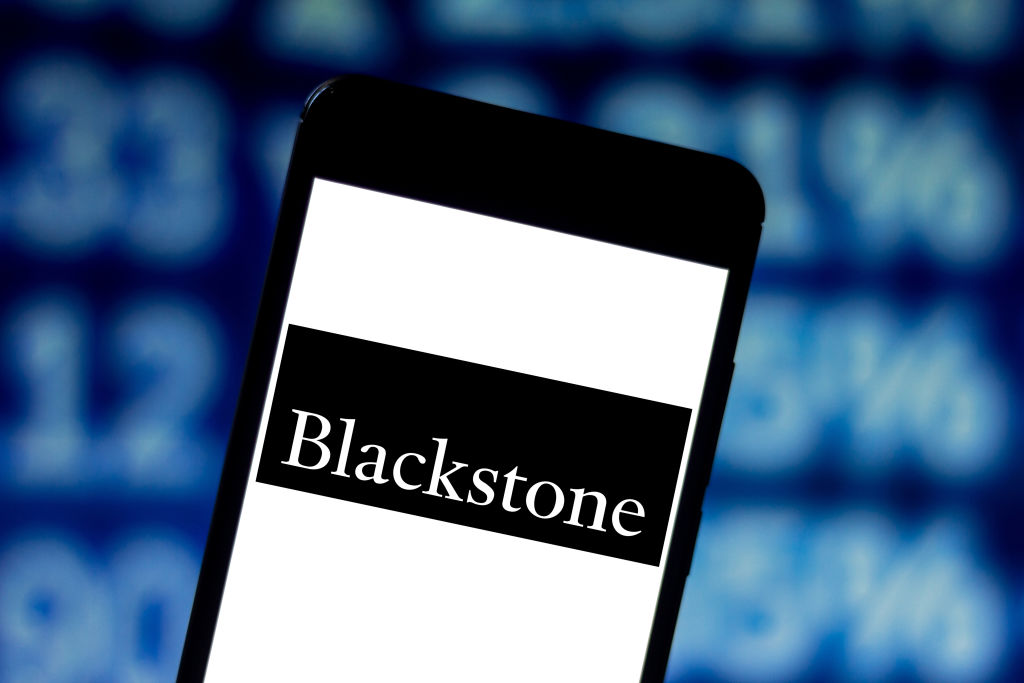 In this photo illustration the Blackstone Group logo is seen