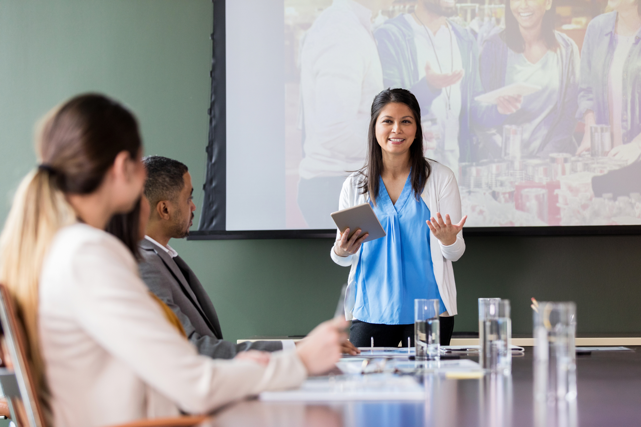 Confident busineswwoman discusses charity event