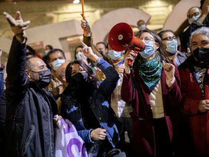 Irací Hassler speaks through a megaphone during the