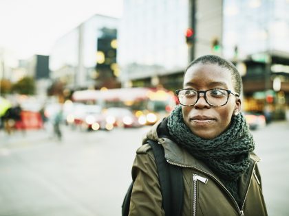Portrait of businesswoman on street while commuting to work