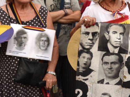 A banner with pictures of people who went missing during the