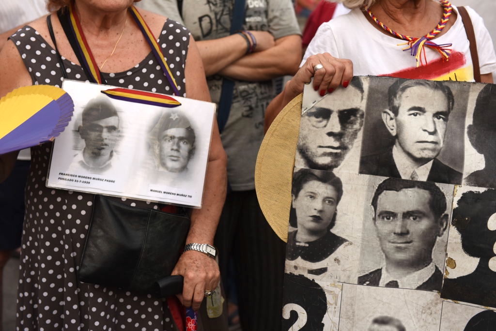 A banner with pictures of people who went missing during the