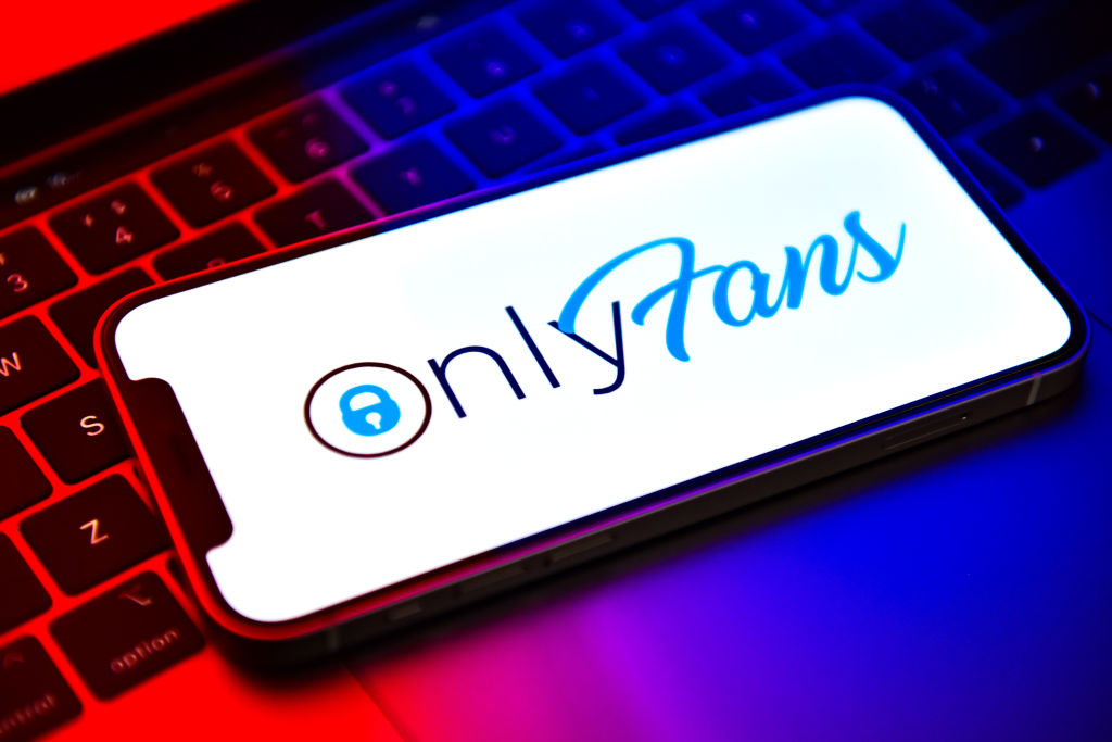 In this photo illustration, an OnlyFans logo seen displayed