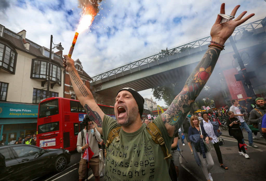 A protester holding a burning flare, during the medical