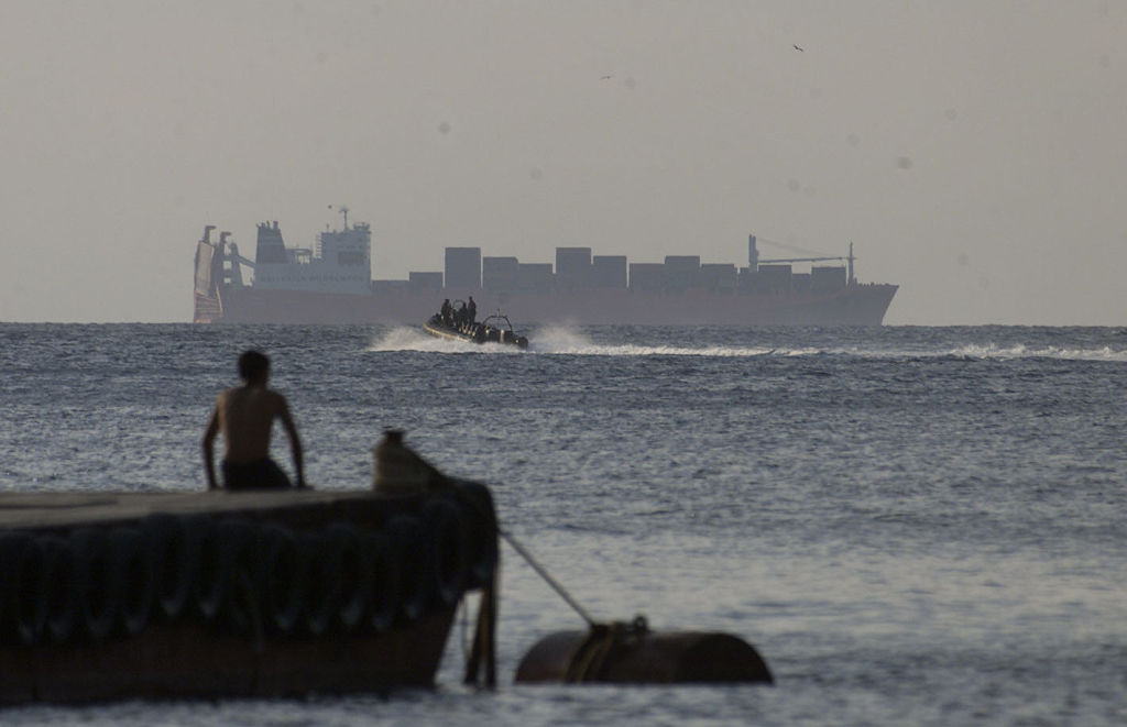 Australian SAS troops head out in an inflatable boat to the Norwegian freighter