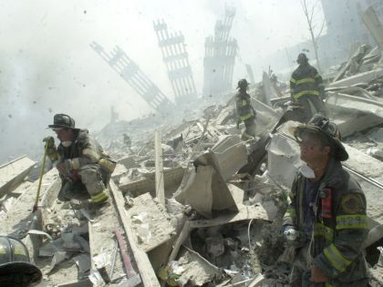 Firefighters search through the rubble of the World Trade Ce