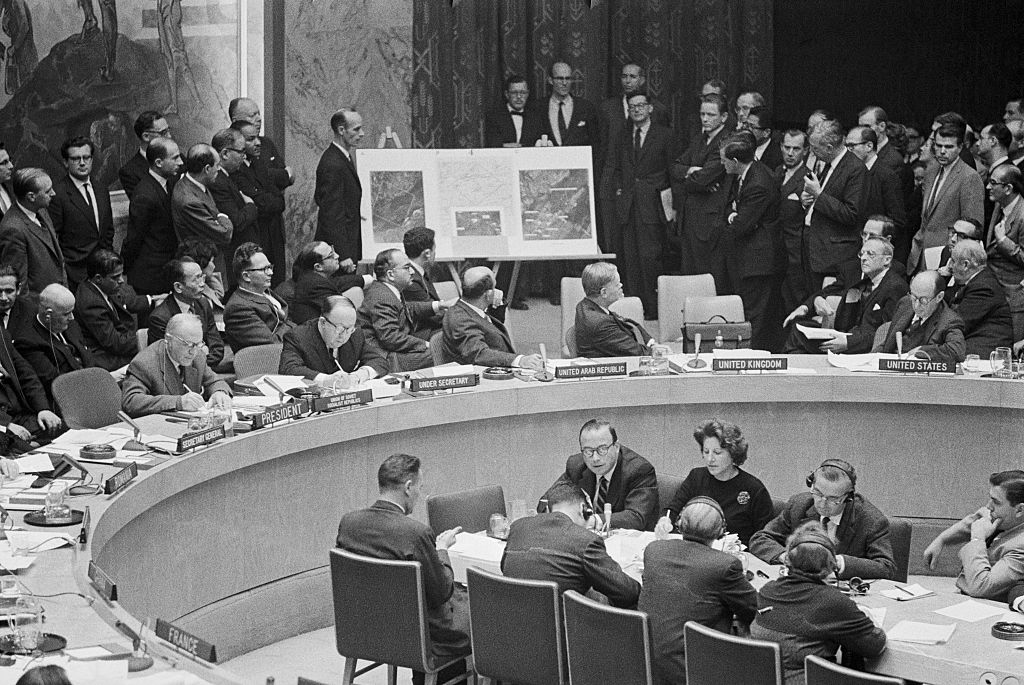 Security Council Delegates Examining Photographs