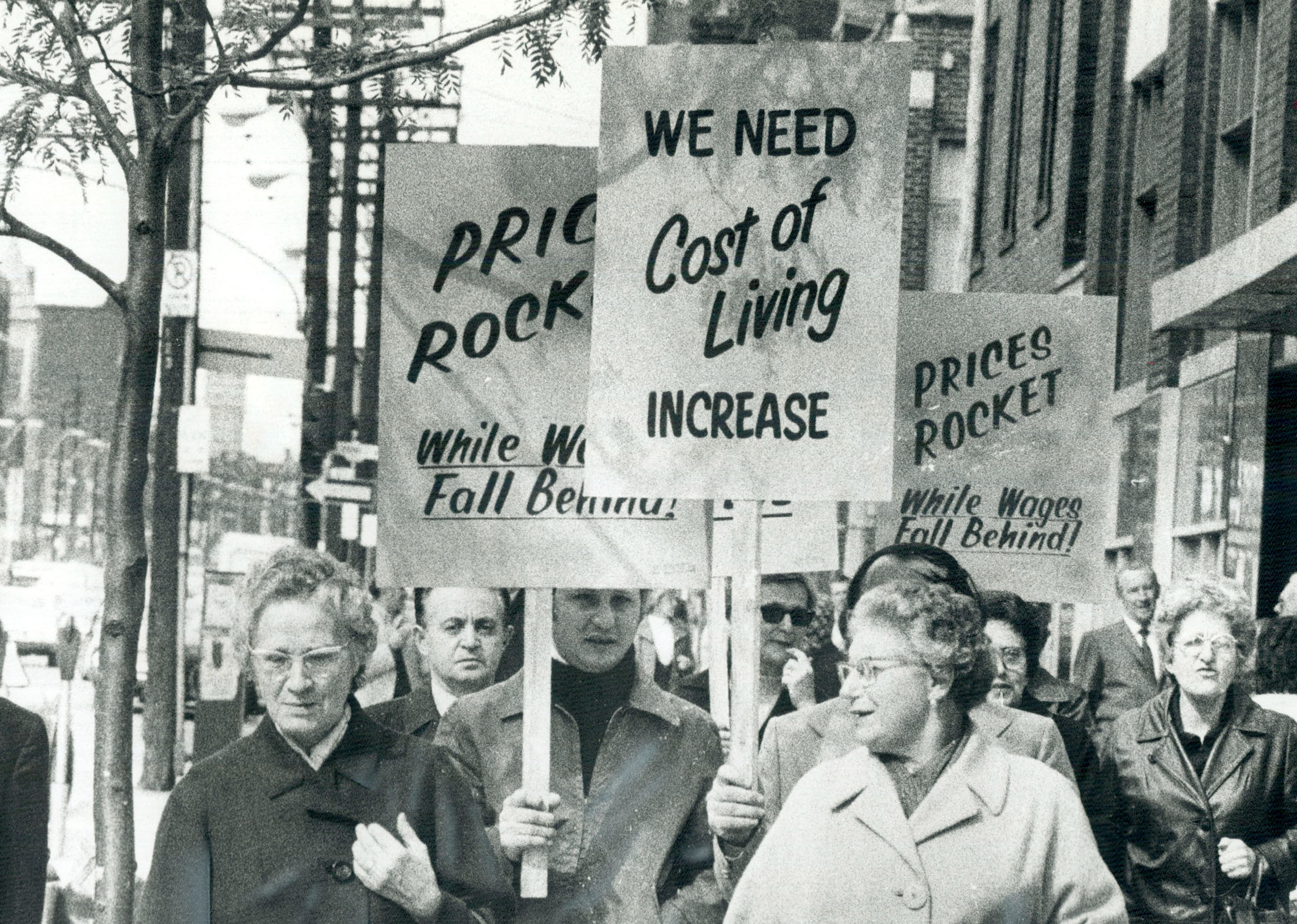 Garment workers demand pay raise; Parading down Spadina Ave.; the cloakmakers' section of the Intern