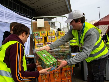 Volunteers unload some of the donations given to the