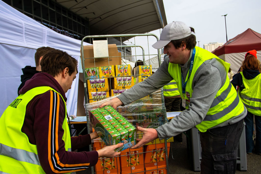 Volunteers unload some of the donations given to the