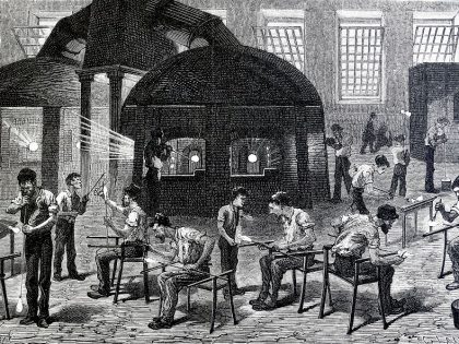 General view of a glassworks, showing men engaged in the various stages of making drinking glasses.