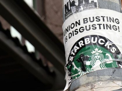 A pro-union poster is seen on a lamp pole outside Starbucks