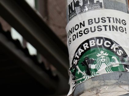 A pro-union poster is seen on a lamp pole outside Starbucks