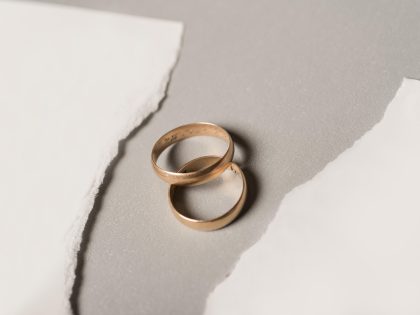 Broken paper with golden wedding rings High quality and resolution beautiful photo concept,Romania