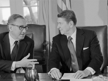 President Reagan Speaking with Henry Kissinger