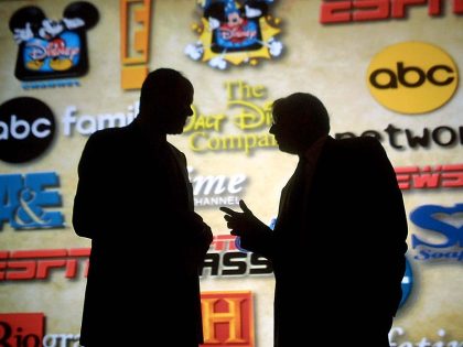 Michael Eisner (L), chairman and CEO of the Walt D