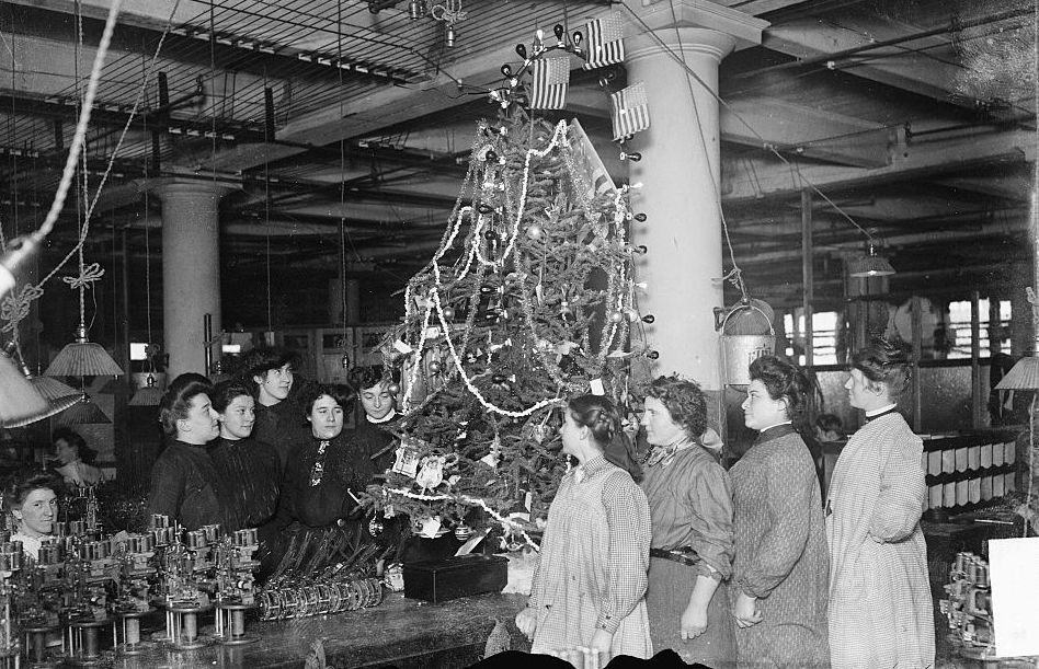 Women Gathered Around Christmas Tree