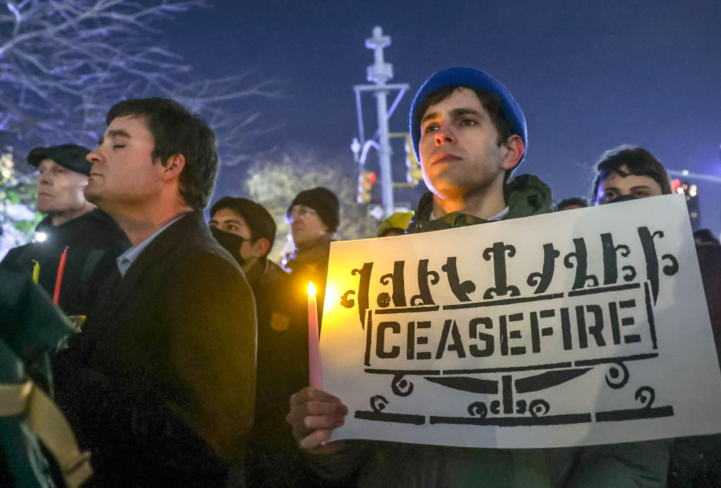 Jewish groups protest demand a ceasefire for Gaza on the first night of Hanukkah in NYC