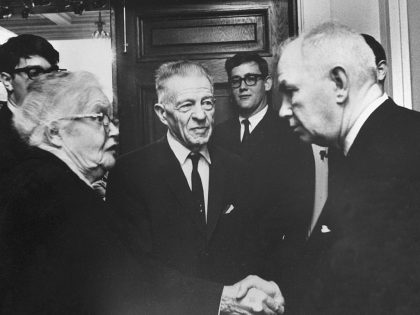 Man Greeting Elderly Couple