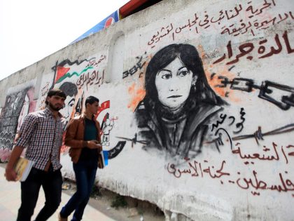 Palestinian children take part in a protest to show solidarity with prisoners held in Israeli jails