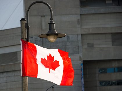 Canadian National flag waving in downtown Toronto.The