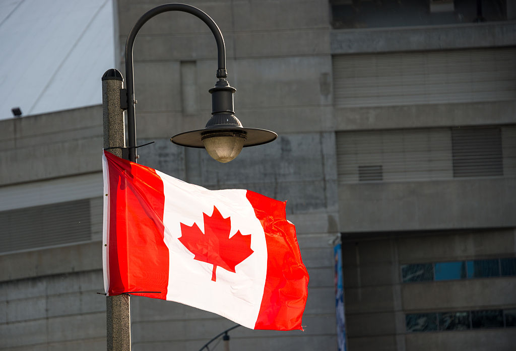Canadian National flag waving in downtown Toronto.The