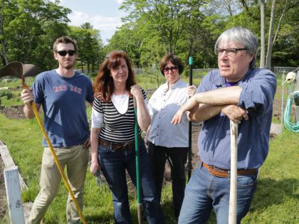 (Jamaica Plain, MA 05/20/16) Gardeners Josh Hoxie (left), Mary Wallace, Rhea Becker, and Chuck Collins (right) talk about the problematic access to water at the South Street Community Garden. Friday, May 20, 2016. Staff photo by John Wilcox.