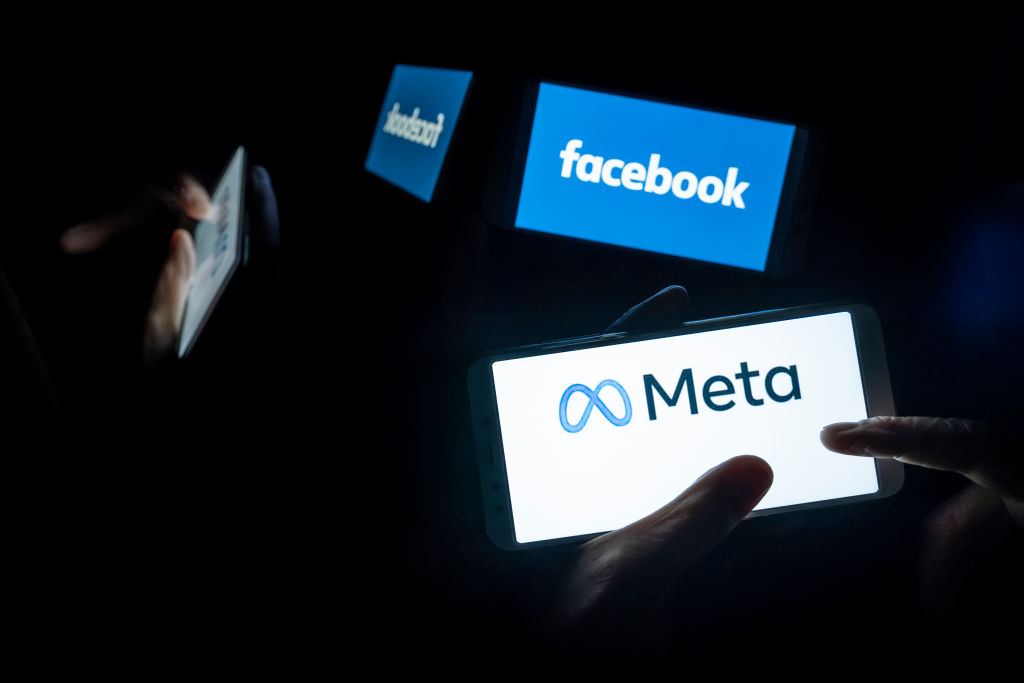 In this photo illustration, Meta and Facebook logos seen