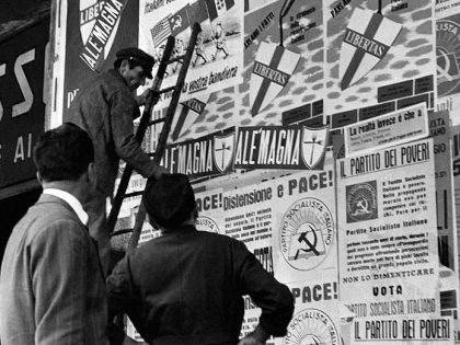 A wall covered with posters of Christian Democratic Party and Italian Socialist Party