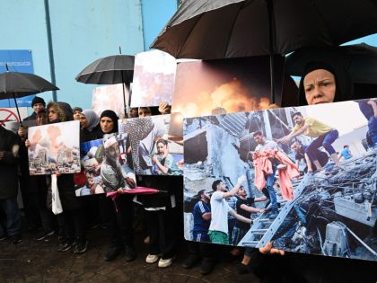 Palestinian refugees in Lebanon demonstrate in front of UNRWA office