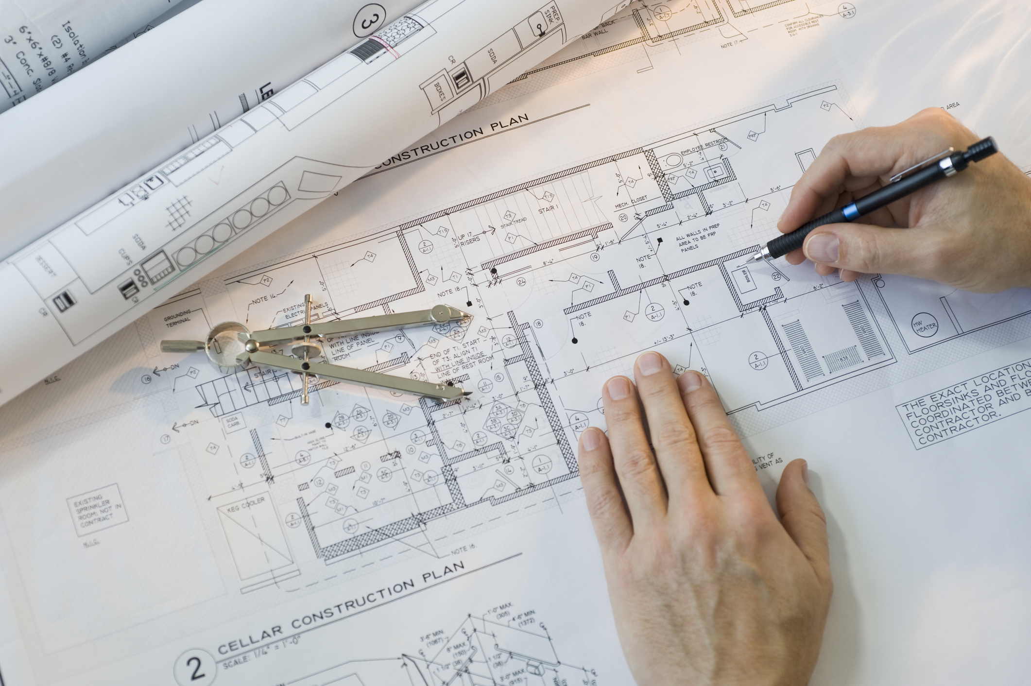 Architect drawing blueprints