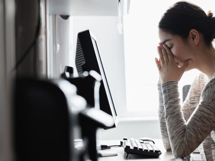 Hispanic woman using computer