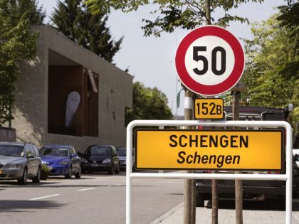 Place-name sign Schengen - name give for the Schengen Agreement, At the left in the background the Musee Europeen.