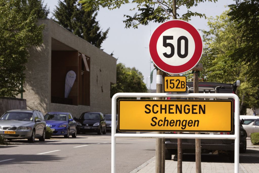 Place-name sign Schengen - name give for the Schengen Agreement, At the left in the background the Musee Europeen.