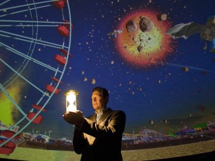 Tom Schmid (CQ), Griffith Observatory lecturer, narrates the new planetarium show "Time's Up," whic