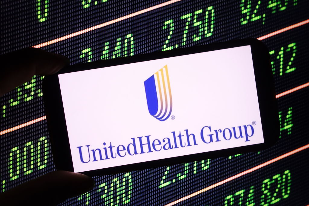 In this photo illustration, the UnitedHealth company logo is